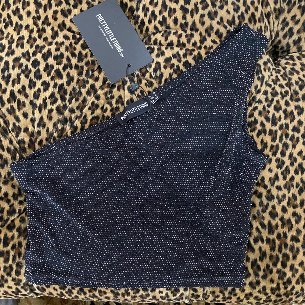 One shoulder black top